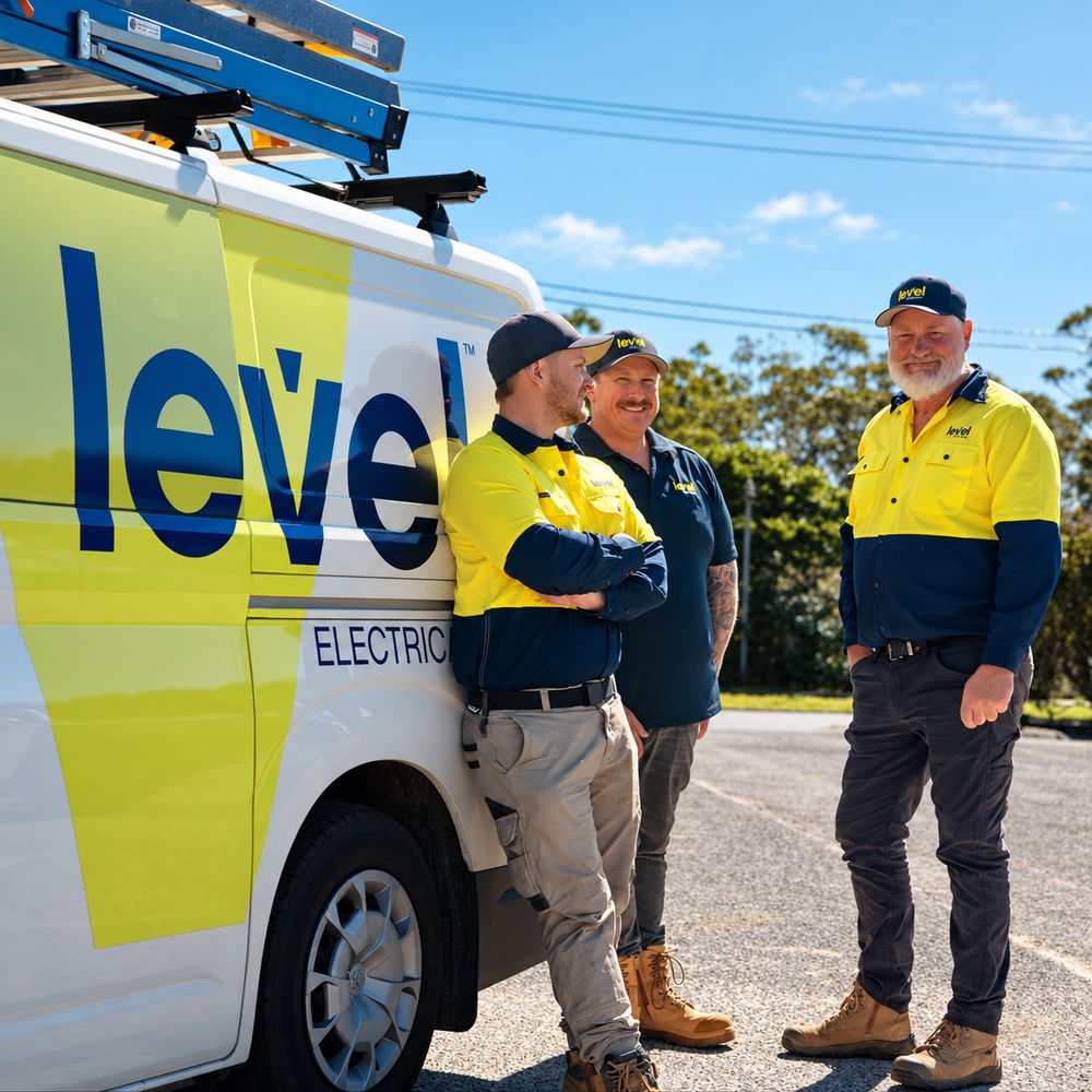 Level electrical team beside a branded van